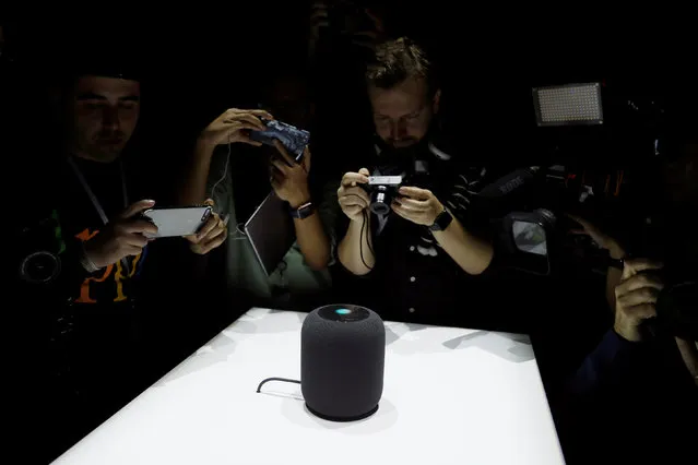 Members of the media photograph a prototype Apple HomePod during the annual Apple Worldwide Developer Conference (WWDC) in San Jose, California, U.S. June 5, 2017. (Photo by Stephen Lam/Reuters)
