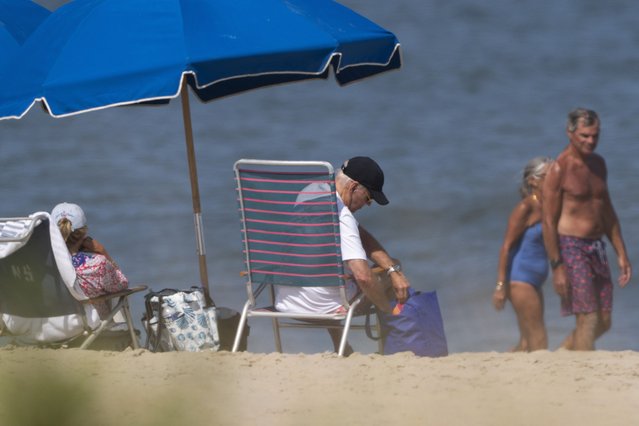 President Joe Biden and first lady Jill Biden lounge on the beach in Rehoboth Beach, Del., August 28, 2024. (Photo by Manuel Balce Ceneta/AP Photo)