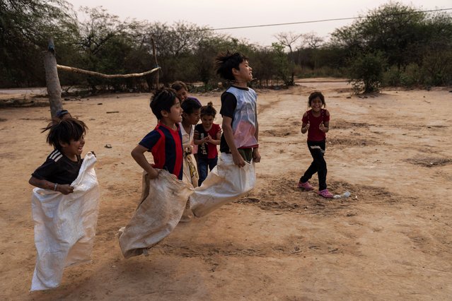 Manjui Indigenous children compete in a sack race in the Abisai community in Mariscal Estigarribia, in the western region of Paraguay known as the Paraguayan Chaco, Wednesday, August 28, 2024. (Photo by Rodrigo Abd/AP Photo)