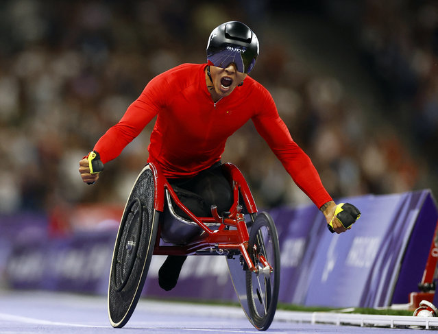 Hua Jin of China celebrates after winning gold in the men's 1500m T54 final in Saint-Denis, France on September 3, 2024. (Photo by Stephanie Lecocq/Reuters)