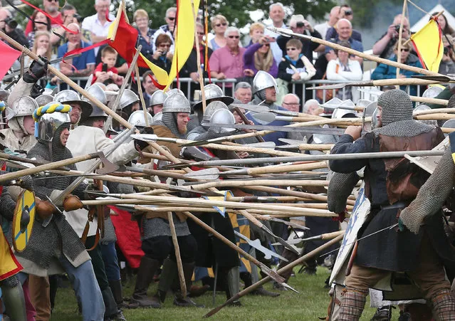 Crowds watch as the Battle of Bannockburn is re-enacted on June 28, 2014 in Stirling, Scotland. The 700th anniversary of the historic battle that saw the outnumbered Scots conquer the English led by Edward II in the First War of Scottish Independence. (Photo by Peter Macdiarmid/Getty Images)