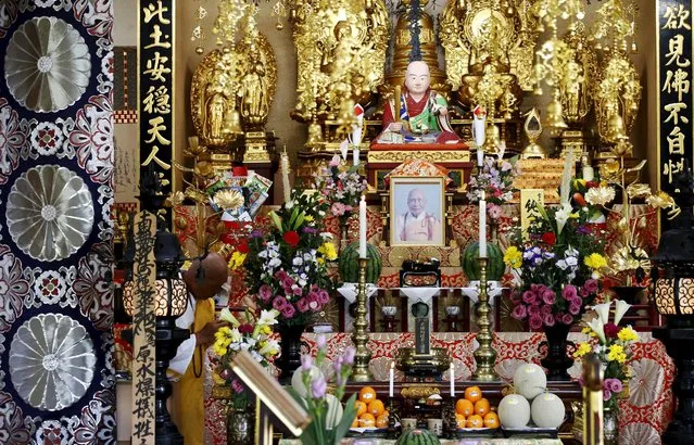 A Buddhist monk prays for victims of the 1945 atomic bombing at Nipponzan Myohjii temple in Nagasaki, western Japan, August 8, 2015, on the eve of the 70th anniversary of the bombing of Nagasaki. Japan will mark on Sunday the 70th anniversary of the attack on Nagasaki, where the U.S. dropped a second atomic bomb on August 9, 1945, which killed about 40,000 instantly. (Photo by Toru Hanai/Reuters)