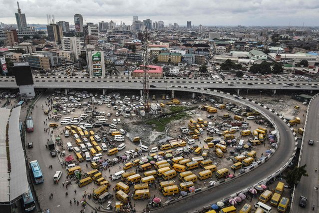 This aerial photograph shows the Obalende bus terminus in Lagos on September 24, 2024. (Photo by Olympia de Maismont/AFP Photo)