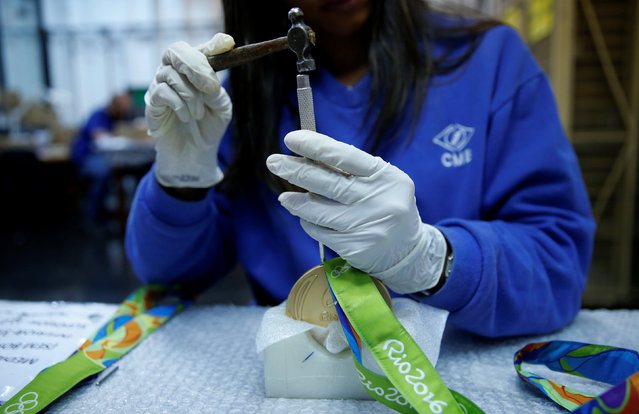 A worker from the Casa da Moeda do Brasil (Brazilian Mint) prepares Rio 2016 Olympic medals in Rio de Janeiro, Brazil, June 28, 2016. (Photo by Sergio Moraes/Reuters)