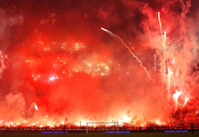 Flares fly and fans get excited for the Copa Libertadores semi-final at Estadio Mas Monumental in Buenos Aires on Wednesday, October 29, 2024. However, Argentinians may have celebrated too soon as their home team, River Plate, was knocked out by Atlético Mineiro of Brazil. (Photo by Agustin Marcarian/Reuters)