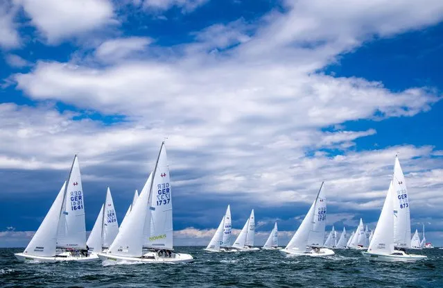 The teams start to the first classification race of the H-Boat World Championship during the Warnemunder Woche on the Baltic Sea on July 5, 2022. After two difficult Corona years, the sailors have started the 84th Warnemunder Woche on 02.07.2022 in the best weather. The organizers expect about 450 boats from 20 countries at the sailing competition. (Photo by Jens Buttner/dpa/Alamy Live News)