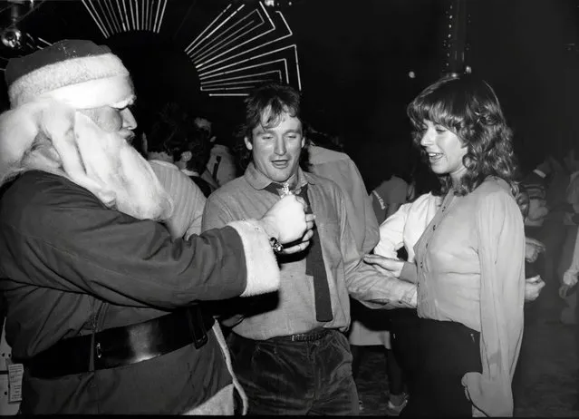Robin Williams dancing with wife Valerie have some fun with Santa Claus at Studio 54 circa 1979 in New York City. (Photo by Robin Platzer/IMAGES/Getty Images)