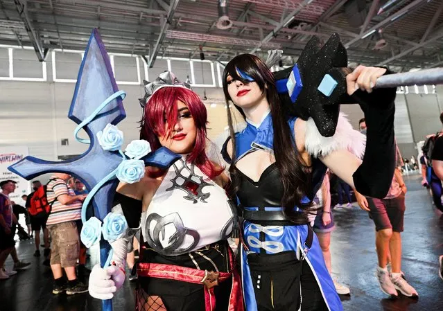 Two women wearing manga-costumes attend the Gamescom 2022 in Cologne, Germany on August 25, 2022. (Photo by Benjamin Westhoff/Reuters)