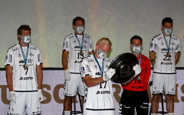 Patrick Wiencek #17 of Kiel celebrates at Sparkassen Arena on June 04, 2020 in Kiel, Germany. The team of THW Kiel was declared the champion of the season 2019/2020 that has been cancelled in April 2020 due to the ongoing coronavirus crisis. (Photo by Martin Rose/Getty Images)