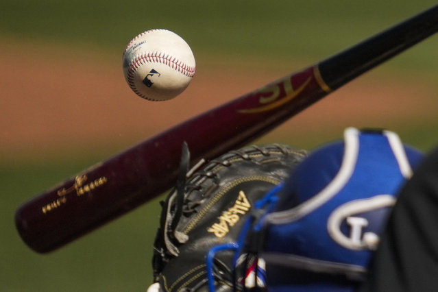 Cincinnati Reds' Jake Fraley swings a strike during the second inning of a spring training baseball game against the Los Angeles Dodgers, Monday, February 24, 2025, in Goodyear, Ariz. (Photo by Ashley Landis/AP Photo)