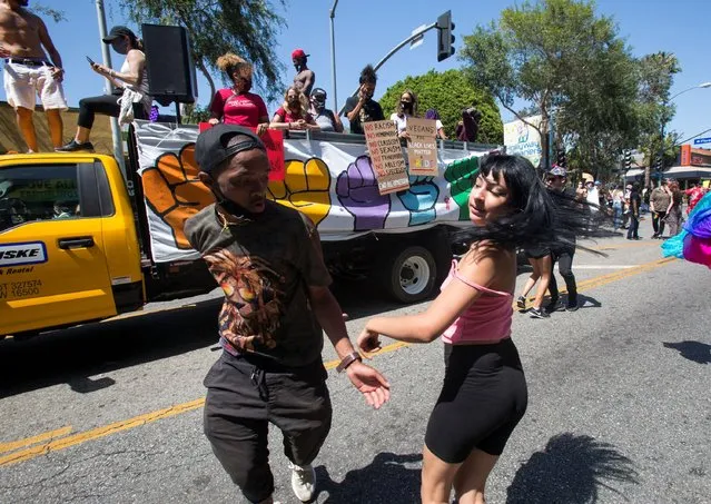 People dance during an All Black Lives Matter march, organized by Black LGBTQ+ leaders, in Hollywood, Los Angeles, California, on June 14, 2020. (Photo by Ringo Chiu/Reuters)