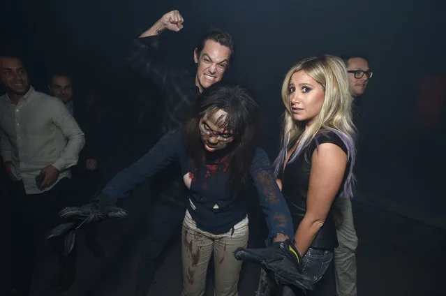 Christopher French, left, and Ashley Tisdale attend the season five premiere of “The Walking Dead” at AMC Universal Citywalk on Thursday, October 2, 2014, in Universal City, Calif. (Photo by John Shearer/Invision for AMC/AP Images)