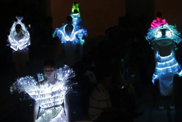 Models display creations by Portuguese jewelry designer Olga Noronha during the ModaLisboa fashion week, in Lisbon, Portugal, Friday, October 10, 2014. (Photo by Francisco Seco/AP Photo)