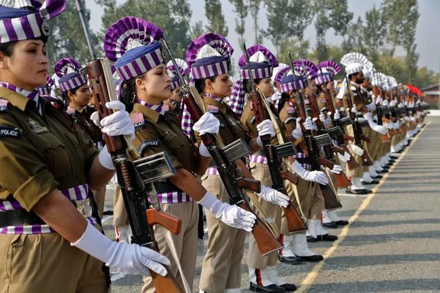 Jammu and Kashmir policewomen participate in a parade to mark Police Commemoration Day on the outskirts of Srinagar, India, Tuesday, October 21, 2014. The annual Police Commemoration Day is observed to remember and pay respect to policemen who have fallen in the line of duty. (Photo by Mukhtar Khan/AP Photo)