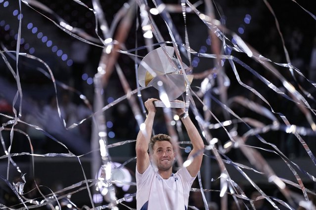 Norway's Casper Ruud holds the trophy after winning the Madrid Open tennis final in Madrid, Spain, Sunday, May 4, 2025. (Photo by Manu Fernandez/AP Photo)