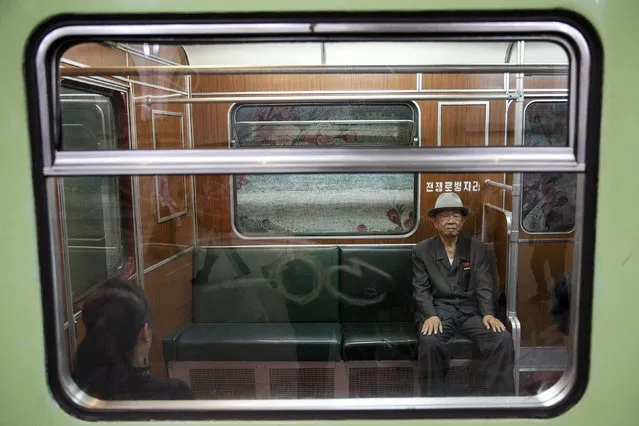 A man looks from inside a train that stopped at a subway station visited by foreign reporters during a government organised tour in Pyongyang, North Korea October 9, 2015. (Photo by Damir Sagolj/Reuters)