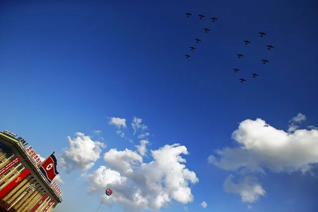 Planes form the number "70" as they fly over Pyongyang's main Kim Il Sung Square during the parade celebrating the 70th anniversary of the founding of the ruling Workers' Party of Korea October 10, 2015. (Photo by Damir Sagolj/Reuters)