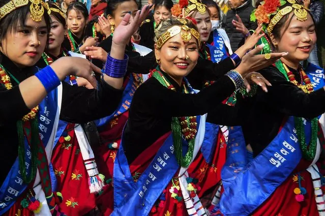 Members of indigenous Gurung community wearing traditional attire takes part with others in a New Year celebration ceremony known as “Tamu Lhosar” in Kathmandu on December 30, 2022. (Photo by Prakash Mathema/AFP Photo)