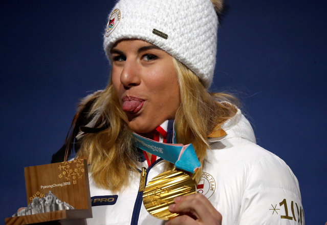 Czech Republic' s gold medallist Ester Ledecka sticks her tongue out on the podium during the medal ceremony for the snowboard women' s parallel giant slalom at the Pyeongchang Medals Plaza during the Pyeongchang 2018 Winter Olympic Games in Pyeongchang on February 24, 2018. (Photo by Jorge Silva/Reuters)