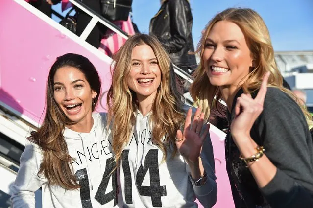 (L-R) Victoria's Secret Models Lily Aldridge, Behati Prinsloo and Karlie Kloss depart for London for the 2014 Victoria's Secret Fashion Show at JFK Airport on November 30, 2014 in New York City. (Photo by Mike Coppola/Getty Images for Victoria's Secret)