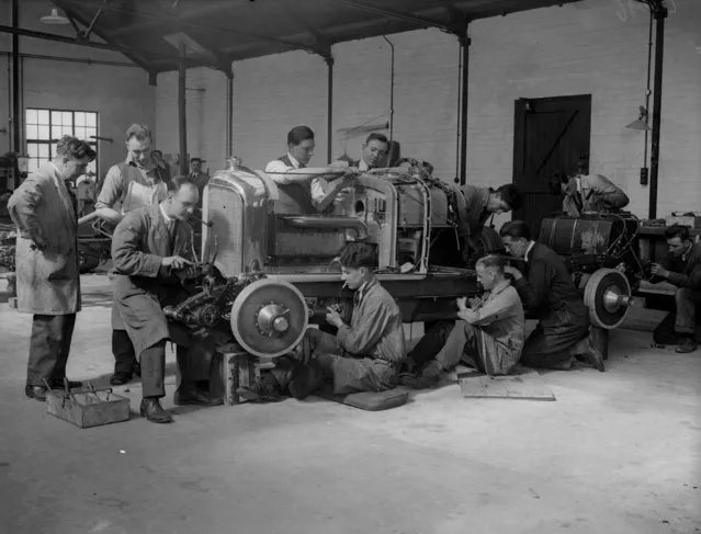 Mechanics at work on the body of a Bentley race car at a garage in Welwyn, Hertfordshire, United Kingdom on March 22, 1930.  (Photo by Fox Photos/Getty Images)
