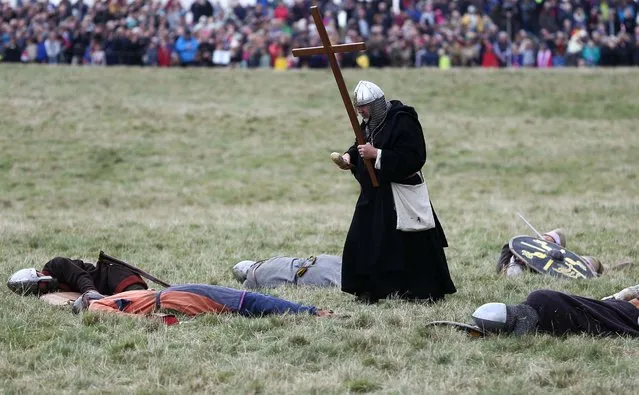 Re-enactors participate in a re-enactment of the Battle of Hastings, commemorating the 950th anniversary of the battle, in Battle, Britain October 15, 2016. (Photo by Neil Hall/Reuters)