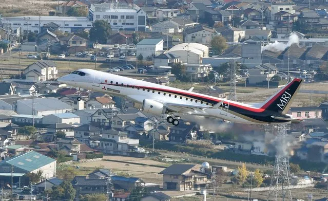 An aerial view shows Mitsubishi Aircraft Corp's Mitsubishi Regional Jet (MRJ) taking off for a test flight at Nagoya Airfield in Toyoyama town, Aichi Prefecture, central Japan, in this photo released by Kyodo November 11, 2015. Japan's first commercial jet in half a century made its maiden flight on Wednesday, in a breakthrough for the country's long-held ambition to establish an aircraft industry that can compete with some of the major players in global aviation. (Photo by Reuters/Kyodo News)