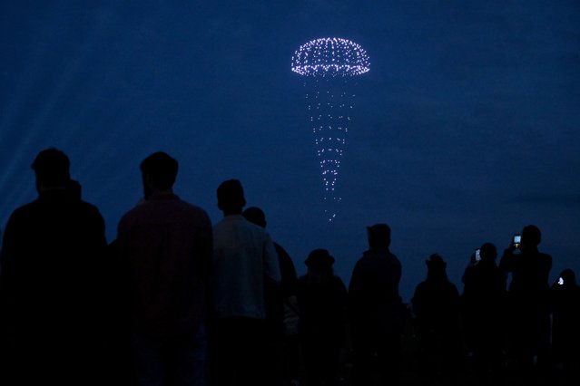 A D-Day themed drone display takes place above the Portsmouth Naval Memorial on Southsea Common, coinciding with illuminations held during a vigil at Bayeux War Cemetery in Normandy, on June 05, 2024 in Portsmouth, England. King Charles III and Queen Camilla lead the commemorative events in Portsmouth ahead of the actual 80th Anniversary of D-Day on June 6th. Veterans, VIP Guests and school children are attending an event on Southsea Common. Portsmouth was where tens of thousands of troops set off to Normandy to participate in Operation Overlord. They established a foothold on the French coast and advanced to liberate northwest Europe. (Photo by Leon Neal/Getty Images)