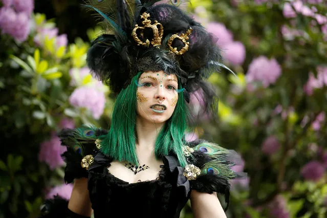 A participant of the Wave and Goth festival seen in a Park in Leipzig, Germany, May 18, 2018. (Photo by Axel Schmidt/Reuters)