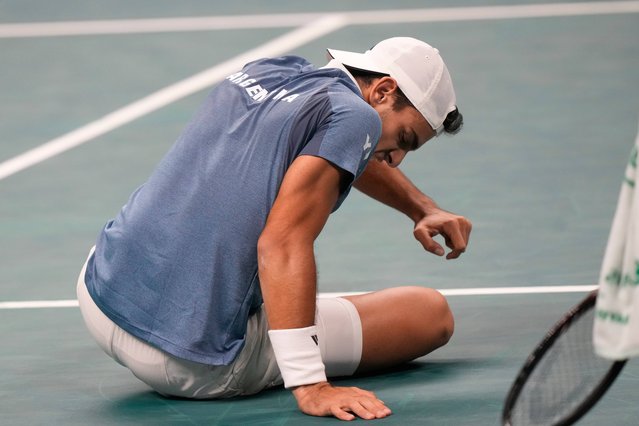 Argentina's Francisco Cerundolo falls as he plays against Germany's Alexander Zverev during a Davis Cup quarterfinal singles tennis match between Germany and Argentina, in Bologna, Italy, Thursday, November 20, 2025. (Photo by Luca Bruno/AP Photo)