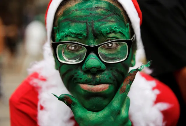 A woman dressed as The Grinch participates in Zombie Walk marking All Souls' Day in Sao Paulo, Brazil, November 2, 2016. (Photo by Nacho Doce/Reuters)