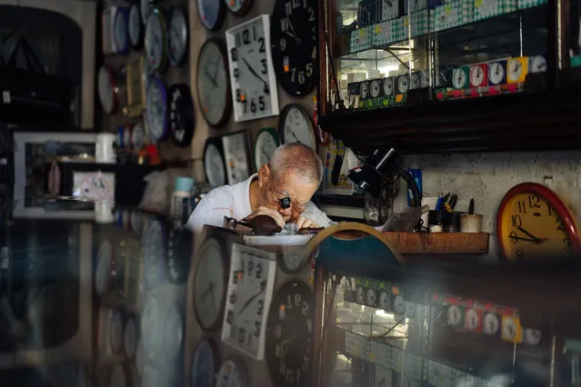 Wai Wah, a watch repairer, works at Yoke Chong watch repair shop in Klang of Selangor state, Malaysia, December 5, 2020. Wai Wah, 84, has been fixing watches and clocks ever since mid 1950s. He is now the only watch repairer who is still working at the age of over 80s, in one out of the four watch shops in old Klang. (Photo by Xinhua News Agency/Rex Features/Shutterstock)