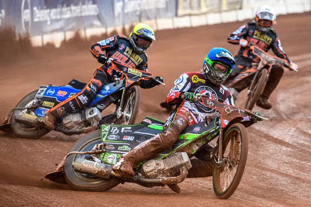 Charles Wright (Blue) leads Steve Worrall (Yellow) and Sam Masters (White) during the Sports Insure Premiership Knock Out Cup Quarter Final 2nd Leg between Belle Vue Aces and Wolverhampton Wolves at the National Speedway Stadium, Manchester on Thursday, 18th May 2023. (Photo by Ian Charles/MI News)