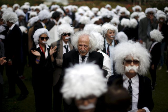 Benny Wasserman, 81, (C) stands with other people dressed as Albert Einstein as they gather to establish a Guinness world record for the largest Einstein gathering, to raise money for School on Wheels and homeless children's education, in Los Angeles, California, United States, June 27, 2015. (Photo by Lucy Nicholson/Reuters)