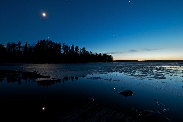 “Cold Truth of Finland”. Got this one captured on 28.4.2012 around 02.00am outside my summerhouse. 2 days before we could walk on ice to the island where my summerhouse is and 2 days after the shot we were going back to mainland with rowing boat. The view in the night was just so amazing, cold bright sky, moon, stars and a little bit sunset in the back as a bonus. Nightless nights here are just amazing. Location: Ylöjärvi, Pengonpohja, Finland. (Photo and caption by Tommi Blom/National Geographic Traveler Photo Contest)