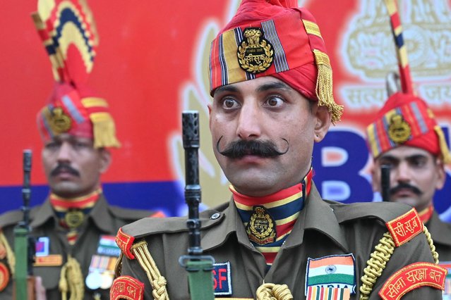 Indian Border Security Force (BSF) soldiers perform during the flag hoisting ceremony as part of the celebrations to mark country's Republic Day at the India-Pakistan Wagah border post, about 35kms from Amritsar on January 26, 2025. (Photo by Narinder Nanu/AFP Photo)
