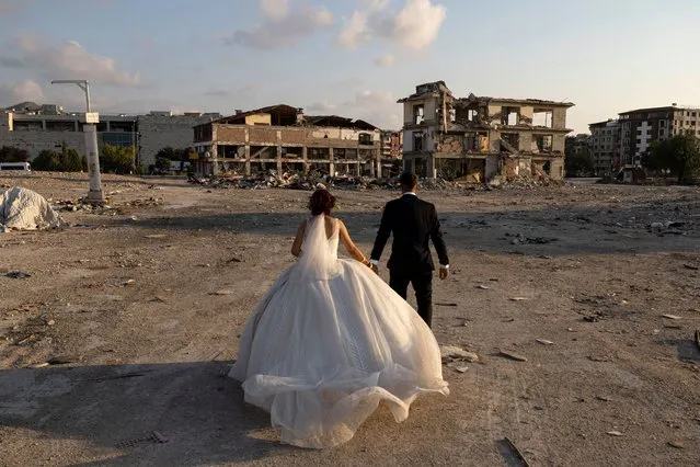 Caner Can Özkanand Hamide Büşra Çağlar, who got engaged before the earthquake in Hatay, got married in Antakya Pazar Yeri container city where their families were staying on June 27, 2023 in Hatay. (Photo by Dia Images/Getty Images)