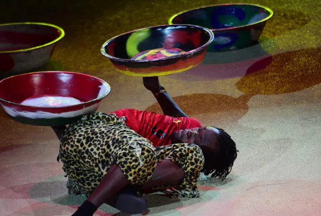 Juggler Isaac Aborah of Ghana performs at the Capital Circus during the 11th edition of the International Circus Festival on January 7, 2016 in Budapest. The festival takes place from January 7 to 11, 2016. (Photo by Attila Kisbenedek/AFP Photo)