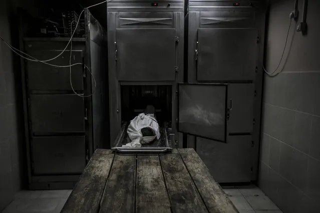 Dead body of 11-year-old Deema Asaliyeh, who was killed on Israeli attacks, is brought to Indonesia Hospital morgue, in the city of Beit Lahia, Gaza on May 20, 2021. (Photo by Ali Jadallah/Anadolu Agency via Getty Images)