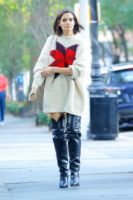 Katie Holmes look stylish while wearing a oversized sweater with knee high boots in New York City on October 10, 2018. (Photo by Felipe Ramales/Splash News and Pictures)