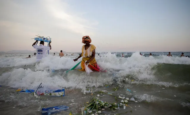 Followers of the Afro-Brazilian religion Umbanda pay tribute for Iemanja, goddess of the sea, in Copacabana Beach in Rio de Janeiro, Brazil December 29, 2016. (Photo by Ricardo Moraes/Reuters)
