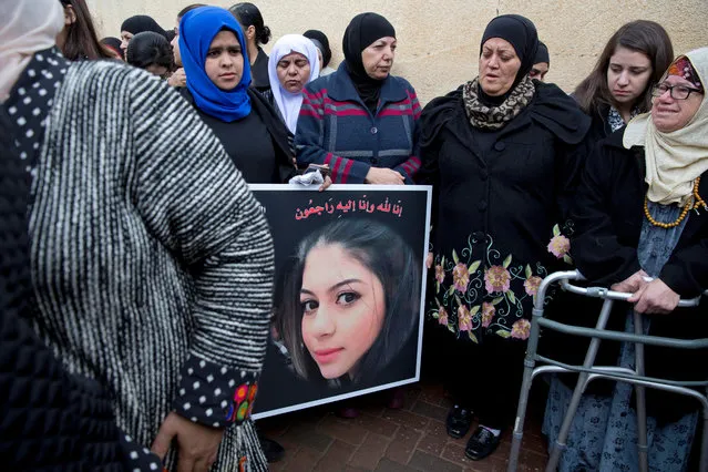 Arab Israeli women mourn during the funeral of Leanne Nasser, who was killed in the New Year's Eve attack in Istanbul, during her funeral, in the town of Tira, Israel, Tuesday, January 3, 2017. Nasser, an 18-year-old Arab-Israeli from the town of Tira, was celebrating with friends when the gunman came in and opened fire. At least 39 people were killed and nearly 70 injured in the mass shooting that took place in front of and inside a popular Istanbul nightclub in the first hours of New Year's Day. The victims included citizens of Turkey, Saudi Arabia, Lebanon, Iraq, France, Tunisia, India, Morocco, Jordan, Kuwait, Canada, Israel, Syria, Belgium, Germany and Russia. (Photo by Ariel Schalit/AP Photo)