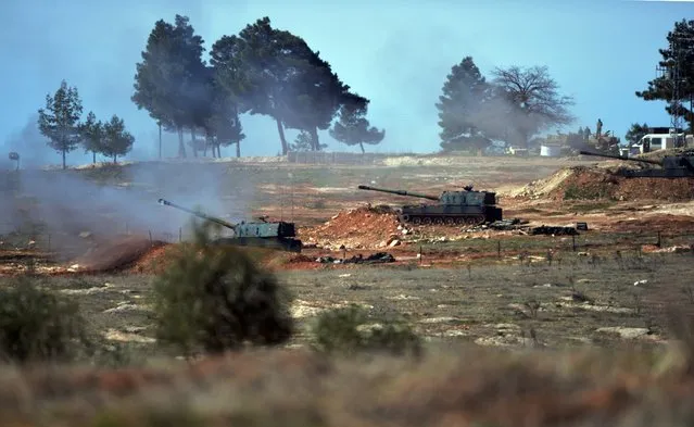 Turkish artillery fire from the border near Kilis town toward northern Syria, in Kilis, Turkey, Tuesday, February 16, 2016. A Turkish official says his country is pushing the case for ground operations in Syria, hoping for the involvement of the U.S. and other allies in an international coalition against the Islamic State group. The official told reporters in Istanbul that “without ground operations it is impossible to stop the fighting in Syria” and that Turkey has pressed the issue in recent discussions with the U.S. and other Western nations. (Photo by Halit Onur Sandal/AP Photo)