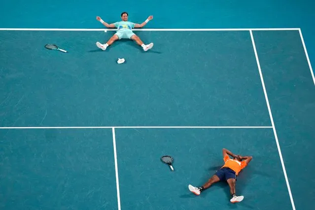 Rohan Bopanna of India and Matthew Ebden, top, of Australia celebrate after defeating Simone Bolelli and Andrea Vavassori of Italy in the men's doubles final the Australian Open tennis championships at Melbourne Park, Melbourne, Australia, Saturday, January 27, 2024. (Photo by Louise Delmotte/AP Photo)