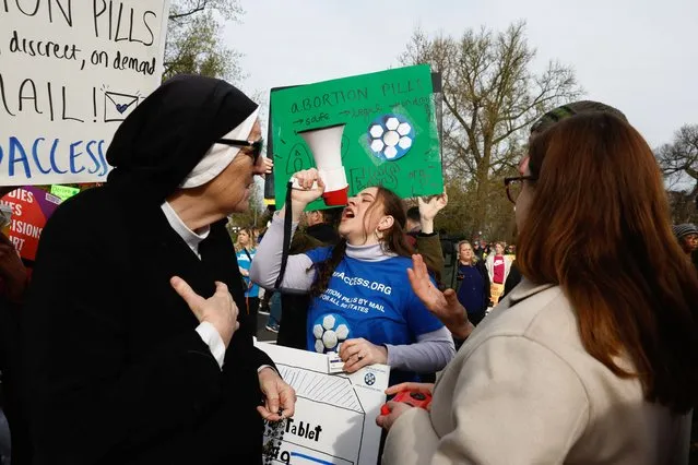 A demonstrator for abortion rights uses a megaphone during a protest outside the U.S. Supreme Court as justices hear oral arguments in a bid by President Joe Biden's administration to preserve broad access to the abortion pill, in Washington, on March 26, 2024. (Photo by Evelyn Hockstein/Reuters)