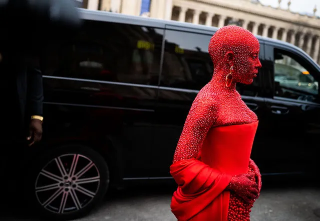 American rapper Doja Cat wears a red Schiaparelli total look and red makeup all over the body, outside Schiaparelli, during Paris Fashion Week - Menswear Fall-Winter 2023-2024, on January 23, 2023 in Paris, France. (Photo by Claudio Lavenia/Getty Images)