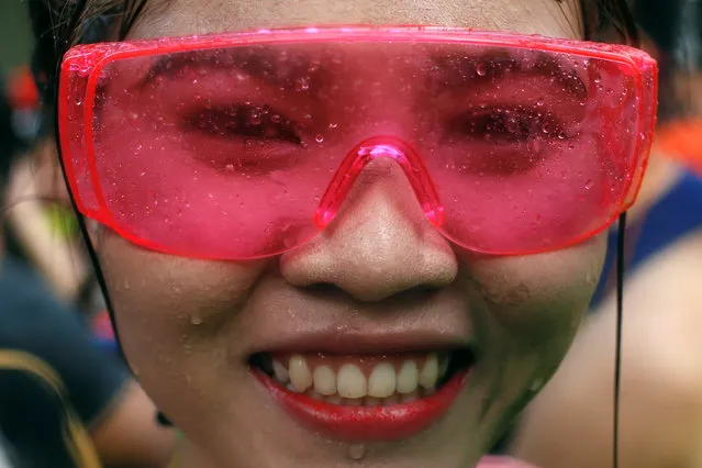 A reveller reacts during a water fight at Songkran Festival celebrations in Bangkok April 13, 2016. (Photo by Jorge Silva/Reuters)