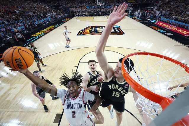 Tristen Newton #2 of the Connecticut Huskies shoots with Zach Edey #15 of the Purdue Boilermakers defending during the first half in the NCAA Men's Basketball Tournament National Championship game at State Farm Stadium on April 08, 2024 in Glendale, Arizona. (Photo by Brett Wilhelm/NCAA Photos via Getty Images)