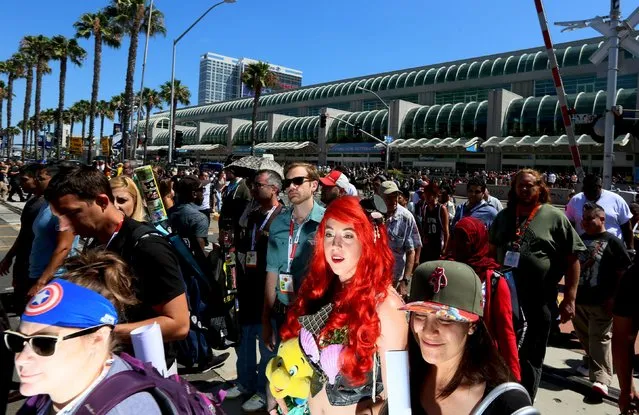 Cosplay enthusiasts walk outside the Convention Centerduring the 2015 Comic-Con International in San Diego, California July 10, 2015. (Photo by Sandy Huffaker/Reuters)