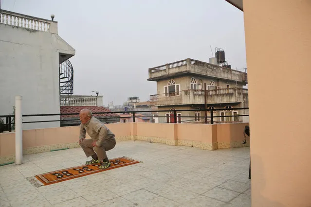 Nepalese mountain climber Min Bahadur Sherchan, does his morning Yoga at his residence in Kathmandu, Nepal, Wednesday, April 12, 2017. The 85-year-old climber who was once the oldest person to scale the world’s highest mountain is heading back to Mount Everest in hopes of scaling the peak and regaining the title. Sherchan is aiming to scale the peak next month when there is window of favorable weather on the summit. (Photo by Niranjan Shrestha/AP Photo)